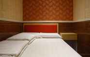 Kamar Tidur 4 Wing Sing Hong Guesthouse