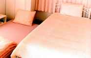 Kamar Tidur 7 Rainbow Guesthouse