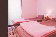 Kamar Tidur Rainbow Guesthouse