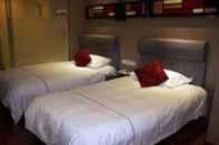 Kamar Tidur Yiwu Bai Heng Hotel