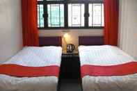 Kamar Tidur Dynasty Commercial Hotel