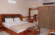 Kamar Tidur 7 Amogha International Hotel