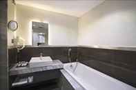 In-room Bathroom Akoni Hotel