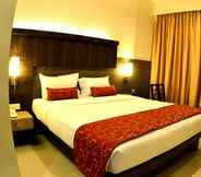 Bedroom 2 Hotel Vinamra Residency