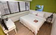 Kamar Tidur 4 Mi Ge Business Hotel