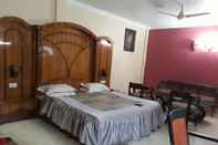 ห้องนอน Hotel Pramod
