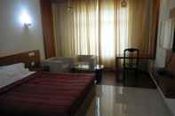 Phòng ngủ Sasthapuri Hotels