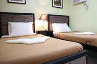 Bedroom Doniti Suites and Events Place