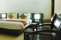 ห้องนอน Hotel Palm Shore