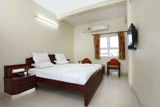 Bedroom 4 Sri Aarvee Hotels