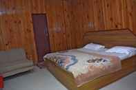 Bedroom Hotel Dogra Residency Bar and Resturant