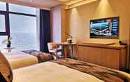 Bedroom 2 Ramada Plaza Dongxing City Center