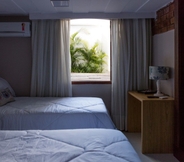 Bedroom 6 Camboinhas Pousada Casa das Janelas Azuis