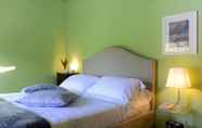 Kamar Tidur 4 Guesthouse ai Santinelli