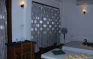 Kamar Tidur 4 Birds Paradise Hotel