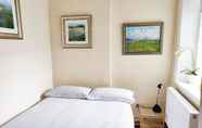 Kamar Tidur 7 Comfortable Apartment in Central London