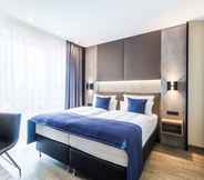 Phòng ngủ 4 Sky Hotel Cloppenburg