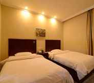 Bedroom 4 GreenTree Inn JiangSu ZhenJiang DingMao Industrial Park WoDe Square Express Hotel