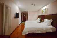 Bedroom GreenTree Inn JiangSu ZhenJiang DingMao Industrial Park WoDe Square Express Hotel