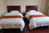 ห้องนอน GreenTree Inn Shangrao Yushan County Boshi Avenue Hotel