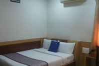 Kamar Tidur Hotel White Parrot