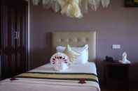 Kamar Tidur Golden Beach Resort Hotel