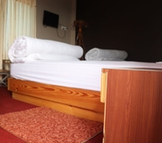 Kamar Tidur 7 Hotel Young's Stupa