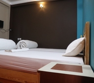 Kamar Tidur 5 Hotel Young's Stupa