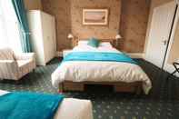 Bilik Tidur The Cowrie Guest House