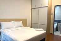 Kamar Tidur One Amerin Mall & Suites