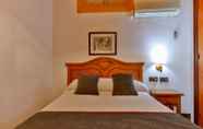 Bedroom 2 Hotel Las Palmeras by Vivere Stays