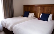 Bilik Tidur 5 Camelot Guest House & Apartments