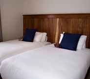 Bilik Tidur 5 Camelot Guest House & Apartments