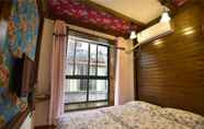 Kamar Tidur 3 Wo Niu Downtown Inn