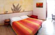 Bilik Tidur 4 Hotel Giorgetti Orange