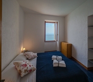 Bilik Tidur 7 Il Baluardo Sea View Apartment on the Cliff