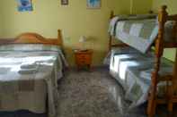 Phòng ngủ Hostal el Portalico
