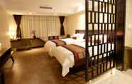 Kamar Tidur 6 Relaxed Season Hotel Longcheng Branch