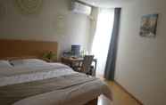 Bedroom 2 GreenTree Inn Anqing Wangjiang County Lantian Road Yiheyuan Express Hotel