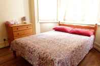 Bedroom SS Property Hub - Family Apartment Barons Court