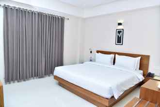 Bilik Tidur 4 Navaratna Inn A Luxury Hotel