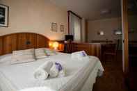 Bedroom Grand Hotel Gortani Wellness & Relax