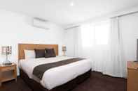 Kamar Tidur New Crossing Place Motel & Apartments