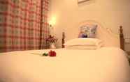 Kamar Tidur 4 Junshe Boutique Guest House - Hostel