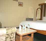 Phòng ngủ 3 Hotel Tathagat Inn