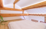 Kamar Tidur 4 ISVARA Culture Homestay Li Mu Space