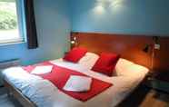 Bedroom 4 Appart'Hotel Les Acacias