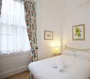 Bedroom 5 A Place Like Home - Two Bedroom Apartment in Knightsbridge