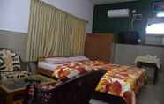 ห้องนอน 3 Vinodhara Guesthouse