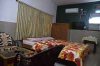 ห้องนอน Vinodhara Guesthouse